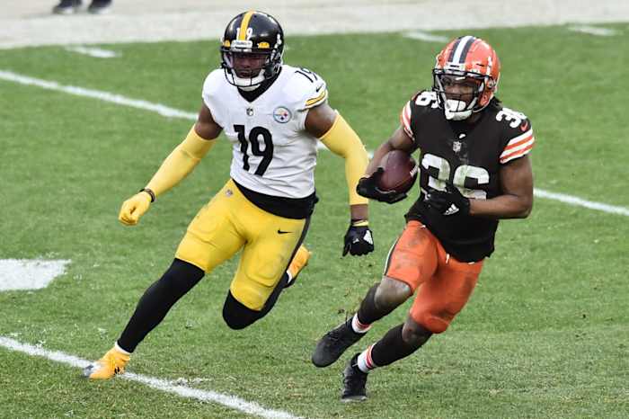 Jan 3, 2021; Cleveland, Ohio, USA; Cleveland Browns cornerback M.J. Stewart (36) returns an interception as Pittsburgh Steelers wide receiver JuJu Smith-Schuster (19) pursues during the second half at FirstEnergy Stadium. Mandatory Credit: Ken Blaze-USA TODAY Sports